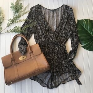 American Eagle romper floral black while sleeved